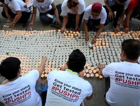 Campaign supporters light on around 1,638 candles representing the number of dead victims claimed by HIV inImage Credit: Agency